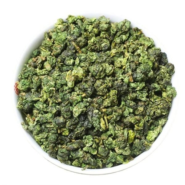 dry tea leaves of Osmanthus Fragrance "Huang Jin Gui" Oolong Tea from Anxi in a white plate