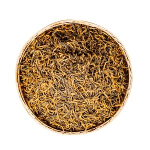dry tea leaves of golden bud jin jun mei