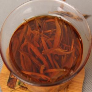 brewed tea leaves of premium grade golden needle