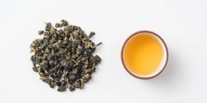 an image showing tie guan yin and its tea water together