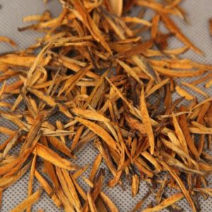 dry loose tea leaves of premium grade golden needle
